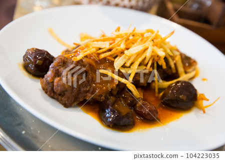 Catalan stew with raisins and plums 104223035