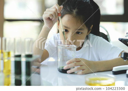 Little child with learning science class in school laboratory Little child with learning science class in school laboratory 104223300