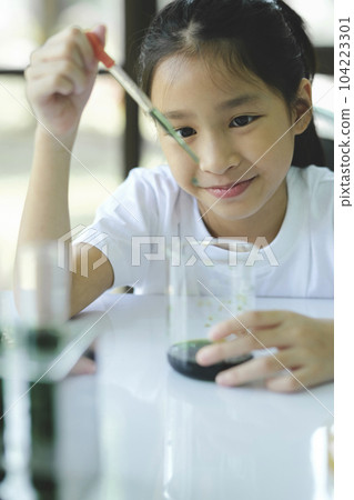 Little child with learning science class in school laboratory Little child with learning science class in school laboratory 104223301