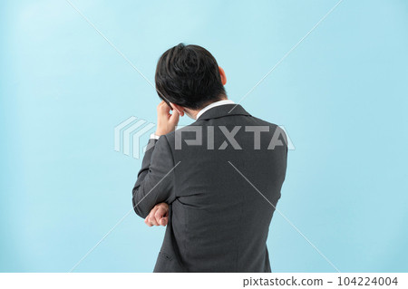 Businessman worried back view 104224004