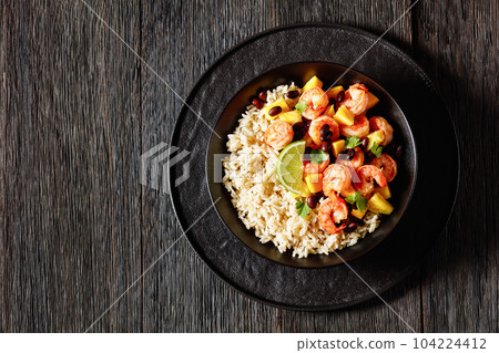 shrimps with beans, mango, brown rice in bowl 104224412