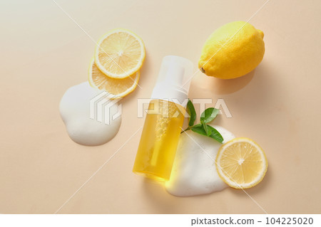 Mockup scene for advertising cosmetic with empty bottle and fresh lemon on beige background. Facial cleanser of lemon essential oil extract have to strengthen and support effective cleansing Mockup scene for advertising cosmetic with empty bottle and fresh lemon on beige background. Facial cleanser of lemon essential oil extract have to strengthen and support effective cleansing 104225020