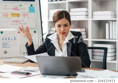 tired business woman sleepy and bored from sitting at a desk for a long time and bored with work has office syndrome tired business woman sleepy and bored from sitting at a desk for a long time and bored with work has office syndrome 104225413