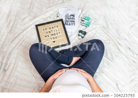 Crop close up of pregnant woman love heart sign belly excited to meet kid child 104225793
