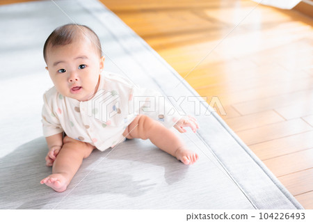 A baby who can now sit on his own A baby who can now sit on his own 104226493