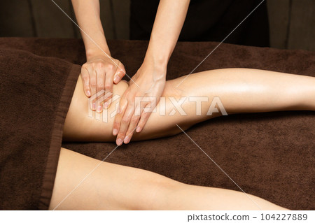 Thigh oil massage Thigh oil massage 104227889