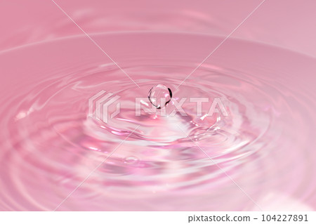 Drops of water falling on the surface of the water. 104227891