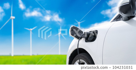 Focus closeup EV car and charger with cordial blur background 104231031