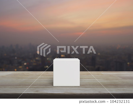 White block cube on wooden table White block cube on wooden table 104232131