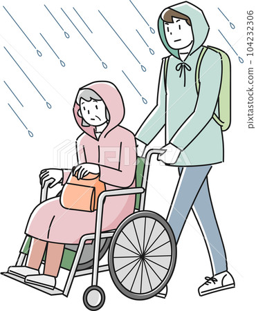 An elderly woman in a wheelchair evacuating from the rain and a man helping 104232306