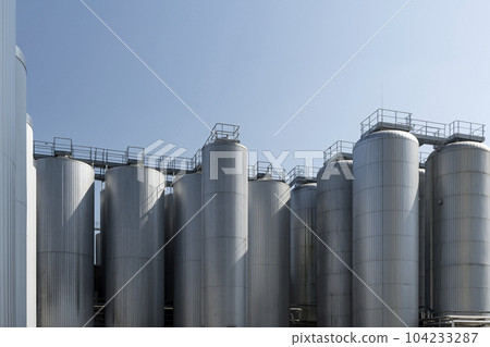 Agricultural silos for storage of grain harvest at an agricultural production farm Agricultural silos for storage of grain harvest at an agricultural production farm 104233287