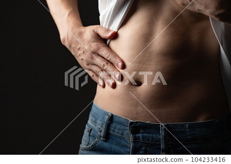 Men pinching their belly fat Diet 104233416