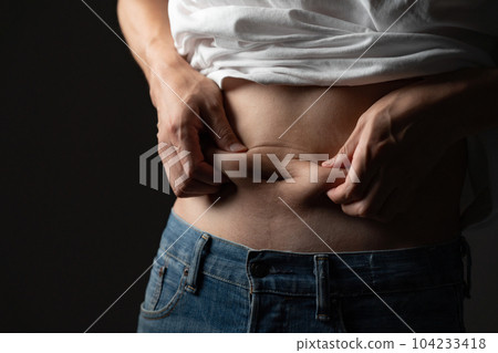 Men pinching their belly fat Diet Men pinching their belly fat Diet 104233418