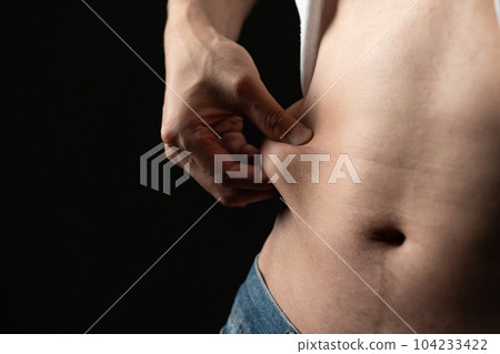 Men pinching their belly fat Diet 104233422