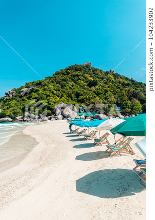 White beach and seaside chairs,relax in summer White beach and seaside chairs,relax in summer 104233902