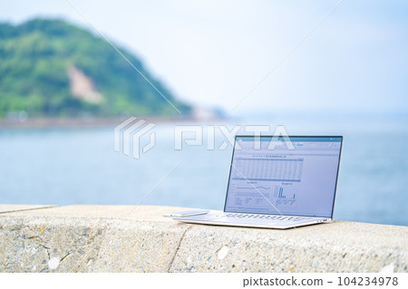 Telecommuting with a view of the sea Telework Workation Spreadsheet Graph Beach Clerk Credit card business 104234978