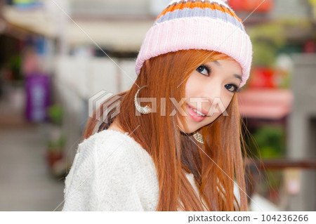 Asian American Woman in beanie cap 104236266