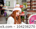 Asian American Woman in beanie cap 104236270