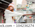Asian American Woman in beanie cap 104236274
