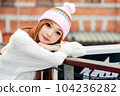 Asian American Woman in beanie cap 104236282