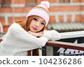 Asian American Woman in beanie cap 104236286