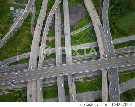 Aerial view city transport junction cross road with green public park transport industry 104237098