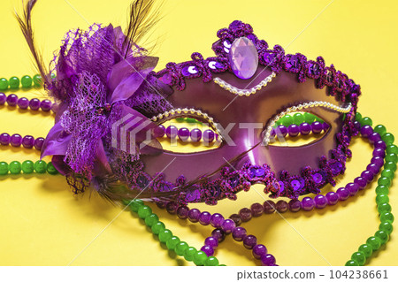 Mardi gras concept. Congratulation card with violet mask on yellow background Top view 2023 Mardi Gras Parade Schedule Mockup Copy space. Mardi gras concept. Congratulation card with violet mask on yellow background Top view 2023 Mardi Gras Parade Schedule Mockup Copy space. 104238661