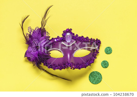 Mardi gras concept. Congratulation card with violet mask on yellow background Top view 2023 Mardi Gras Parade Schedule Mockup Copy space. Mardi gras concept. Congratulation card with violet mask on yellow background Top view 2023 Mardi Gras Parade Schedule Mockup Copy space. 104238670
