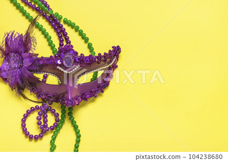 Mardi gras concept. Congratulation card with violet mask on yellow background Top view 2023 Mardi Gras Parade Schedule Mockup Copy space. Mardi gras concept. Congratulation card with violet mask on yellow background Top view 2023 Mardi Gras Parade Schedule Mockup Copy space. 104238680