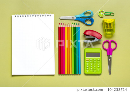 Frame from school and office supplies Paper clips, pens, calculator, sharpener, notepad, stapler isolated on green background Flat lay Top view Back to school, education concept Mock up Copy space. Frame from school and office supplies Paper clips, pens, calculator, sharpener, notepad, stapler isolated on green background Flat lay Top view Back to school, education concept Mock up Copy space. 104238714