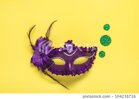 Mardi gras lettering. Congratulation card with violet mask on yellow background Top view 2023 Mardi Gras Parade Schedule Mockup Copy space. Mardi gras lettering. Congratulation card with violet mask on yellow background Top view 2023 Mardi Gras Parade Schedule Mockup Copy space. 104238716
