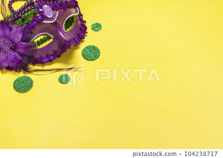 Mardi gras lettering. Congratulation card with violet mask on yellow background Top view 2023 Mardi Gras Parade Schedule Mockup Copy space. Mardi gras lettering. Congratulation card with violet mask on yellow background Top view 2023 Mardi Gras Parade Schedule Mockup Copy space. 104238717