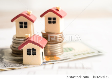 House model with stack of coin money, home loan, saving plan, installment payment finance and banking concept. House model with stack of coin money, home loan, saving plan, installment payment finance and banking concept. 104239149