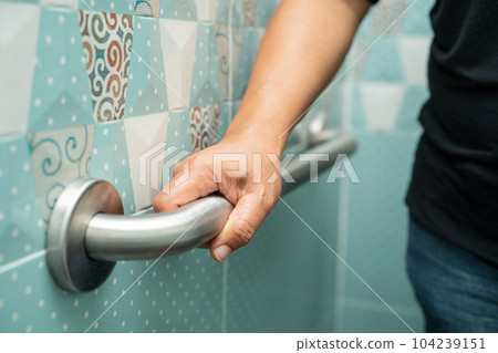 Asian elderly woman use bathroom handle security in toilet, healthy strong medical concept. Asian elderly woman use bathroom handle security in toilet, healthy strong medical concept. 104239151