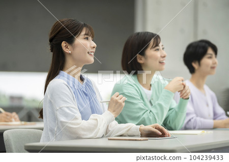 women attending a seminar 104239433