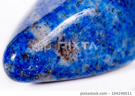Macro mineral stone blue lapis lazuli (afghanistan) on white background 104240011