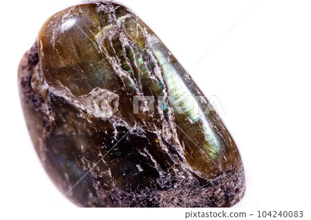 Macro mineral stone Labradorite on white background 104240083