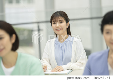 Young woman attending a seminar Young woman attending a seminar 104241261