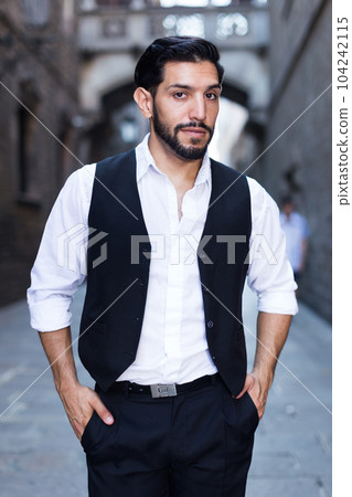 Waist up portrait of man near cathedral Waist up portrait of man near cathedral 104242115
