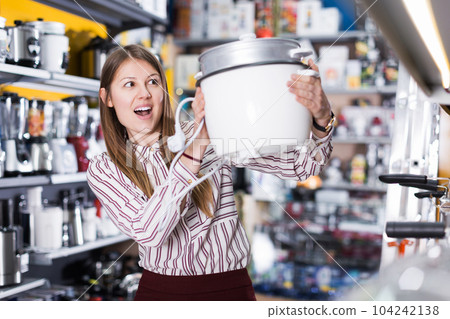 delighted young woman with purchase delighted young woman with purchase 104242138