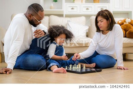 Portrait of happy family father mother and daughter spending vacation Portrait of happy family father mother and daughter spending vacation 104242491