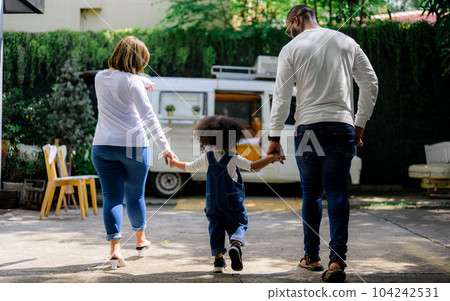 Portrait of happy family father mother and daughter spending vacation Portrait of happy family father mother and daughter spending vacation 104242531
