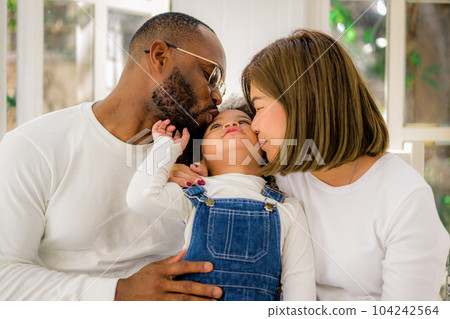 Portrait of happy family father mother and daughter spending vacation Portrait of happy family father mother and daughter spending vacation 104242564