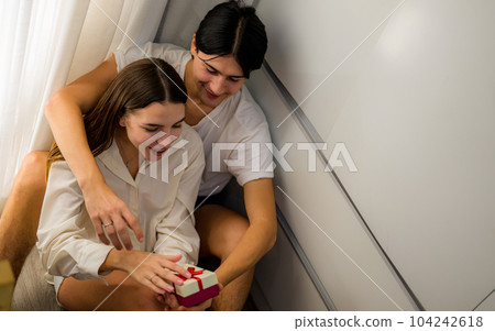 Romantic young people spending vacation time together at home Romantic young people spending vacation time together at home 104242618