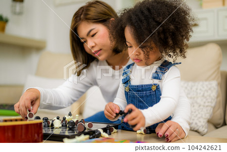 Portrait of happy family father mother and daughter spending vacation Portrait of happy family father mother and daughter spending vacation 104242621