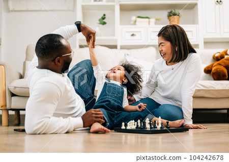 Portrait of happy family father mother and daughter at home Portrait of happy family father mother and daughter at home 104242678