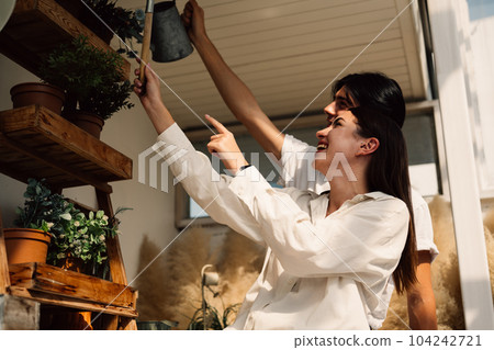 Couple of romantic young people at home, Vintage style photo Couple of romantic young people at home, Vintage style photo 104242721