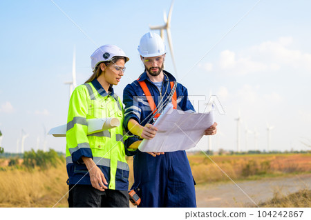 Renewable energy engineer working on wind turbine Renewable energy engineer working on wind turbine 104242867