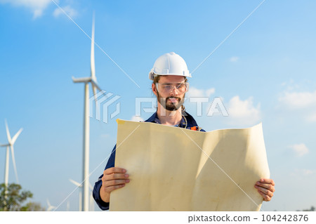 Renewable energy engineer working on wind turbine Renewable energy engineer working on wind turbine 104242876