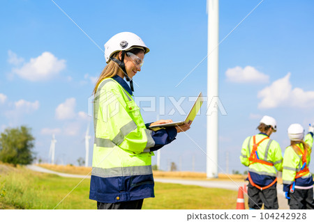 Renewable energy engineer working on wind turbine 104242928